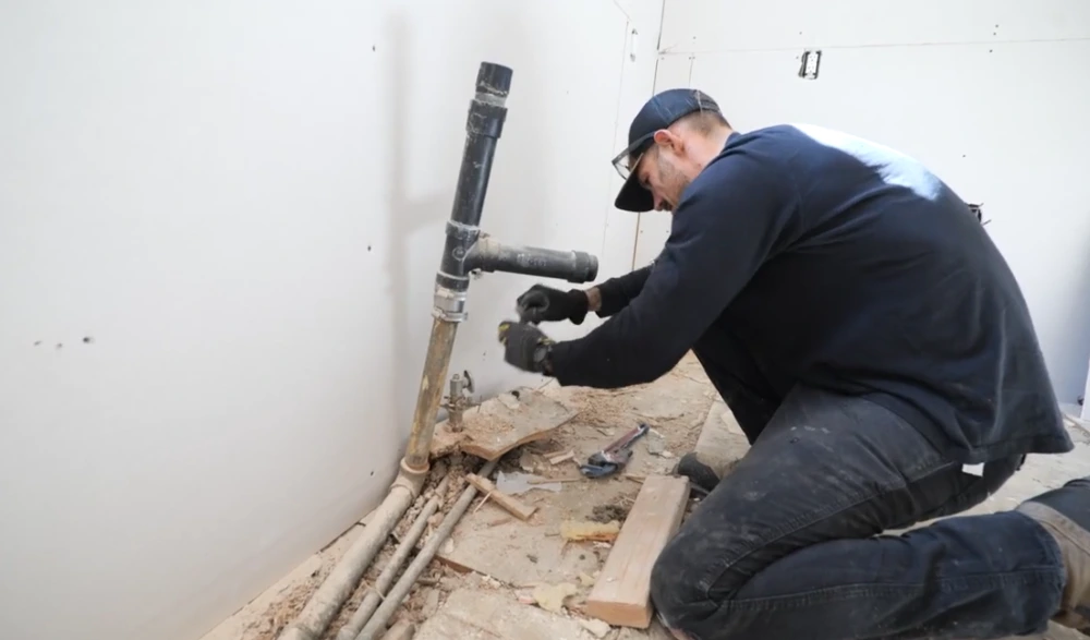 Licensed plumber repairing a pipe fitting in Berthoud, CO
